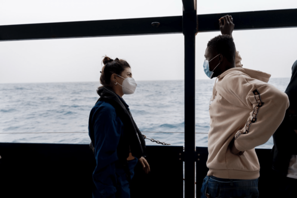 Rachele talking to a guest on board the Sea-Watch 3 in 2022