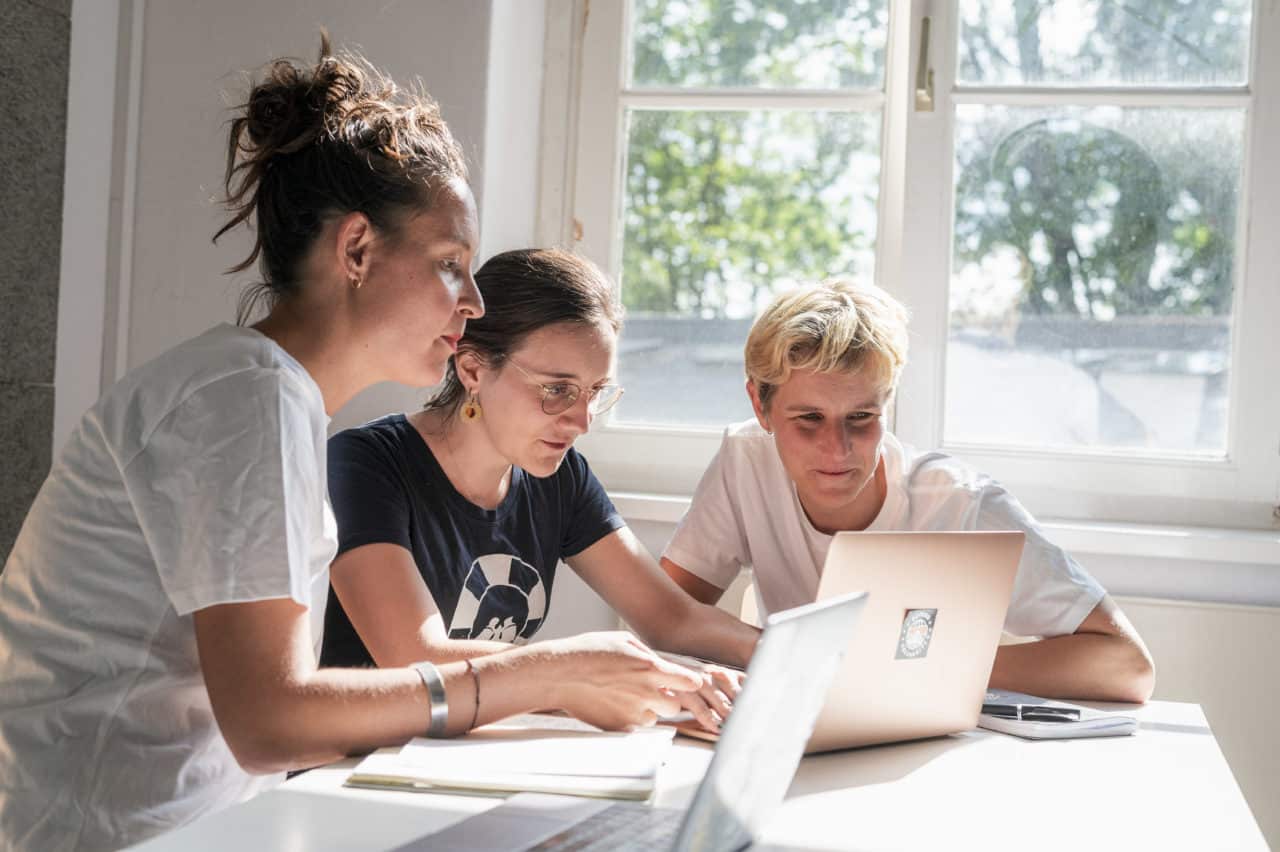 Sea-Watch Team of three working together in our Berlin office